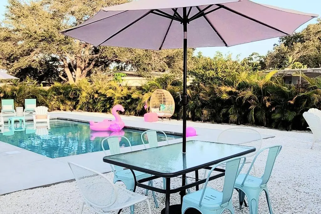 The Pink Flamingo Mid Century Heated Pool Paradise